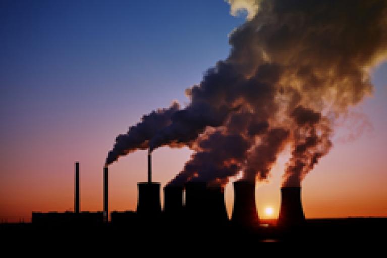 Steam and smoke rising from a coal-fired power plant